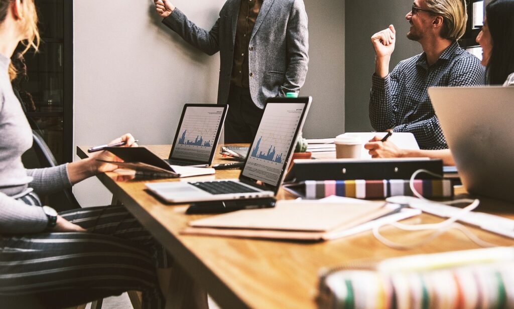 People in a business meeting discussing recruitment and skilled worker visa strategy.